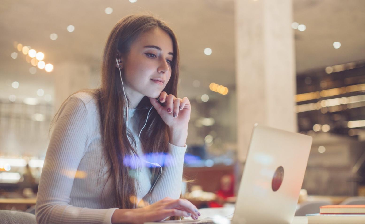 Business owner reviewing cash flow projections on laptop